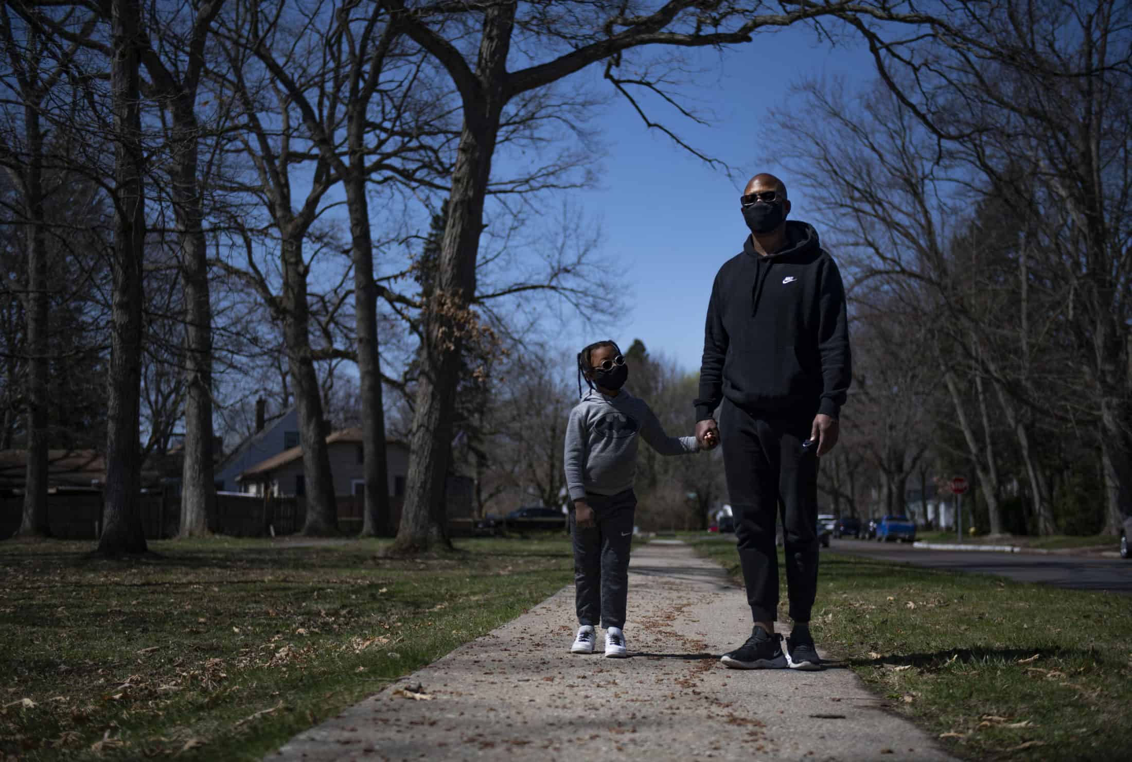 A dad and son go for a walk during COVID-19