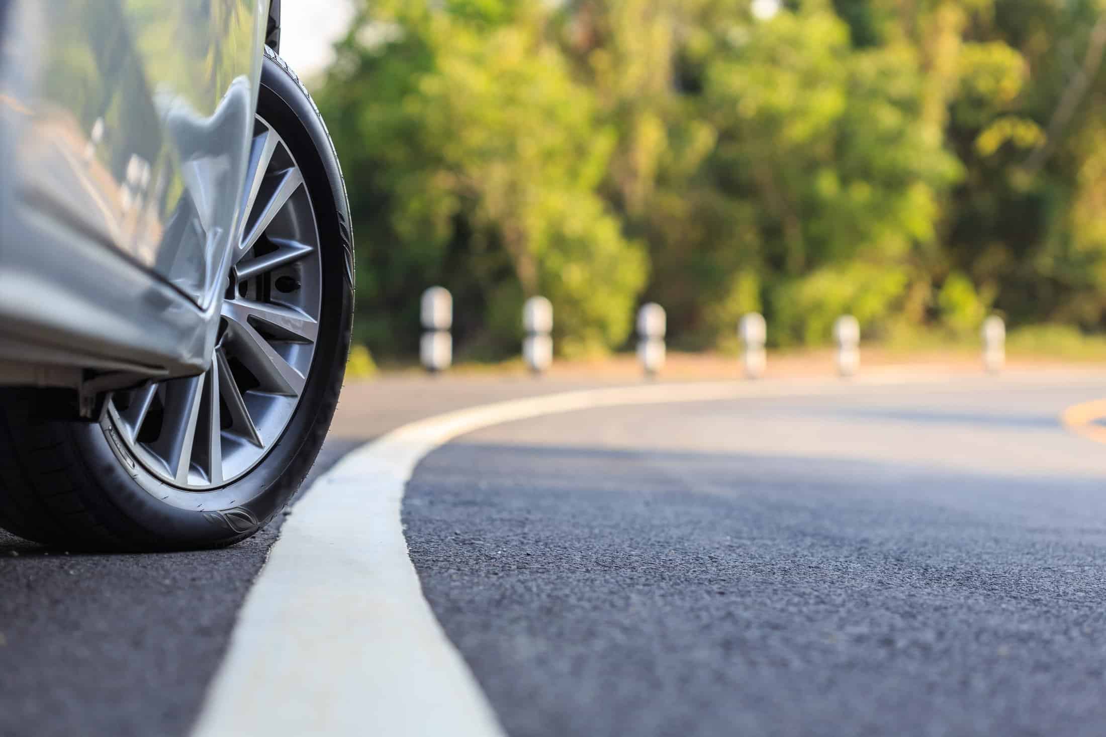Close up of car tire on road.